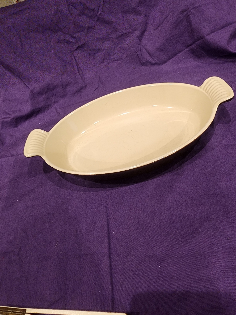 Le Creuset Oval Ceramic Baking Dish in Brown with Side Handles